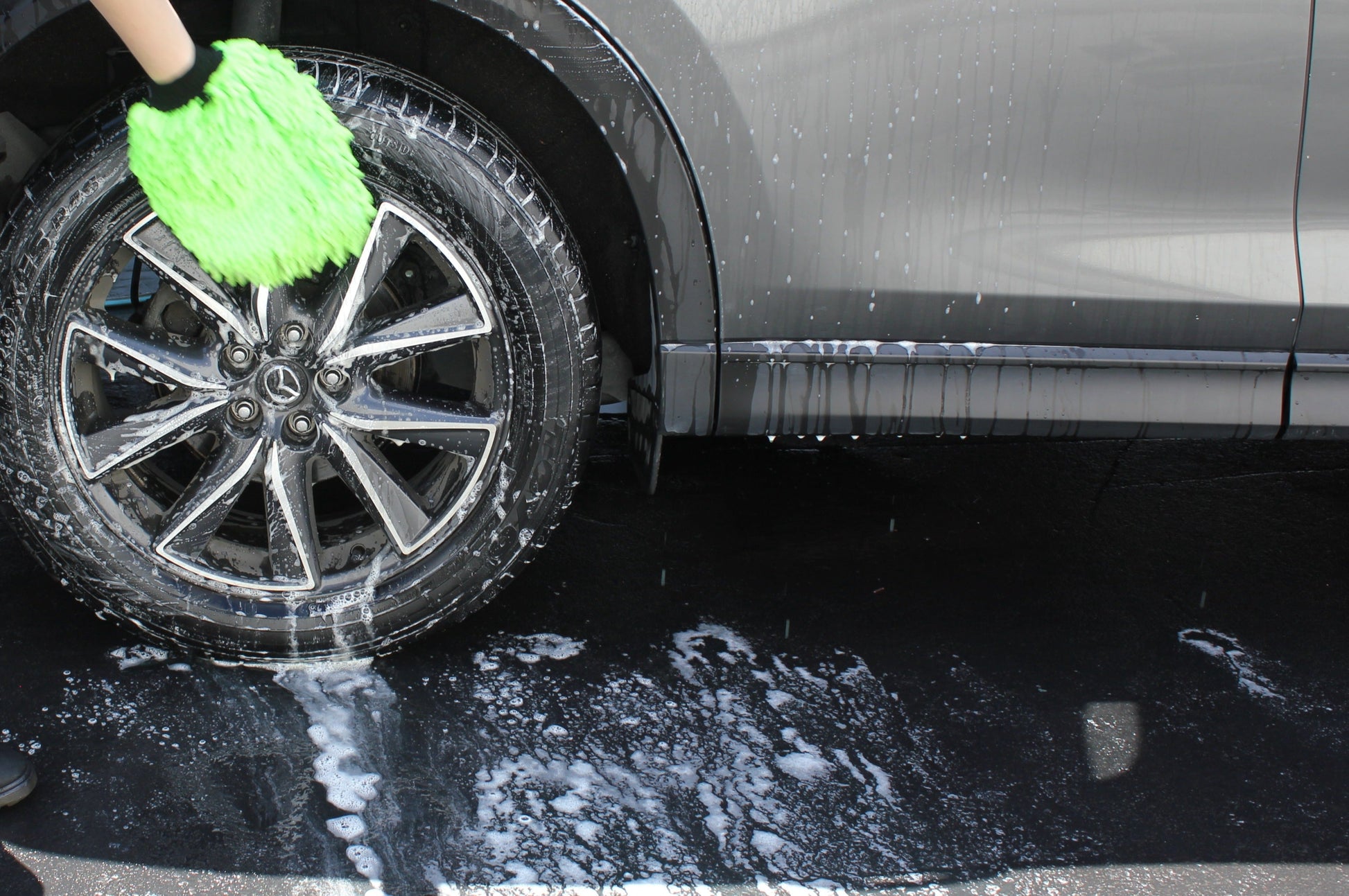 Washing Wheels with Wash Mitt
